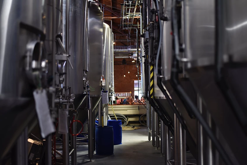 view between vats of beer in a brewery