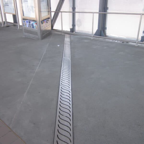 decorative trench drain in an airport walkway