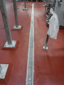 stainless steel drain in a food and beverage plant