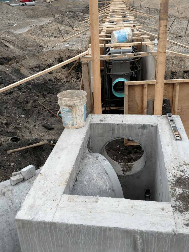 Trench drain connection to structure with pipe