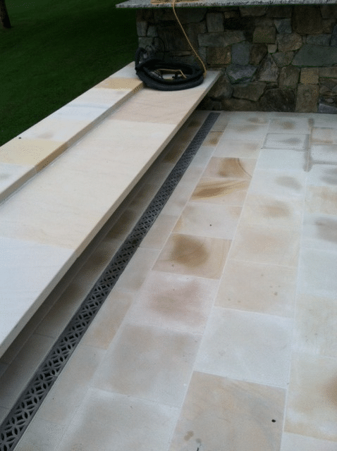 Residential patio trench drain with ornamental aluminum grate