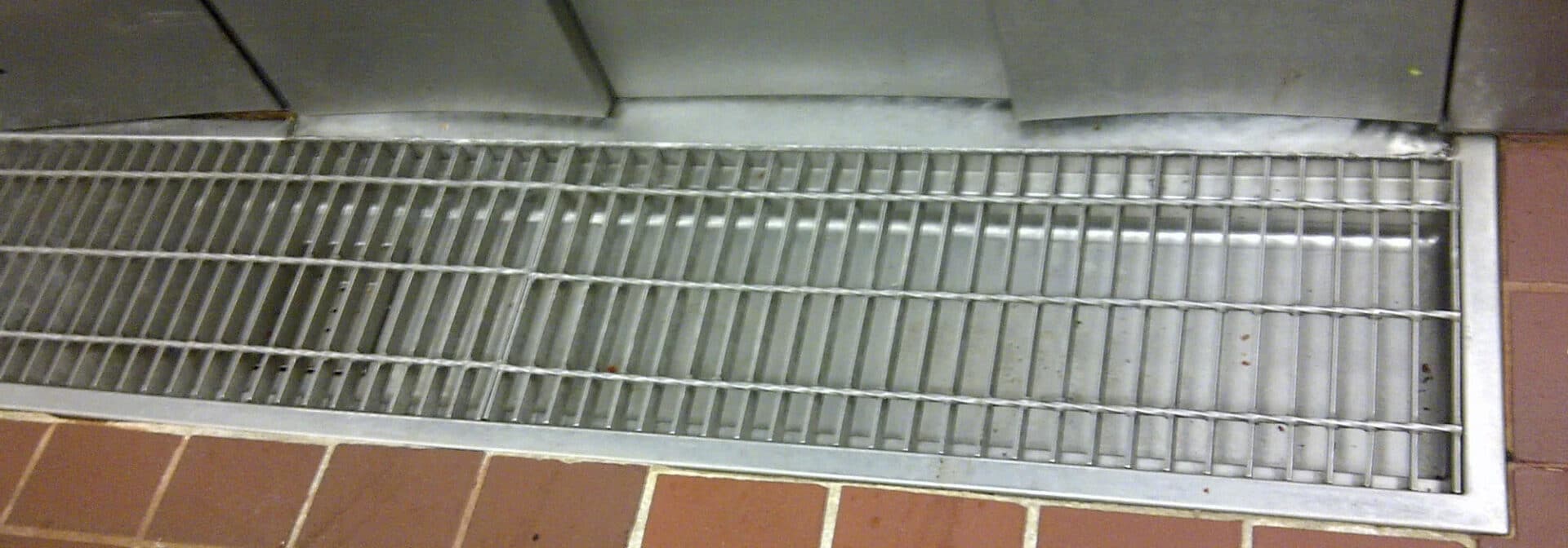 stainless steel trench drain with stainless steel grate in a food and beverage facility