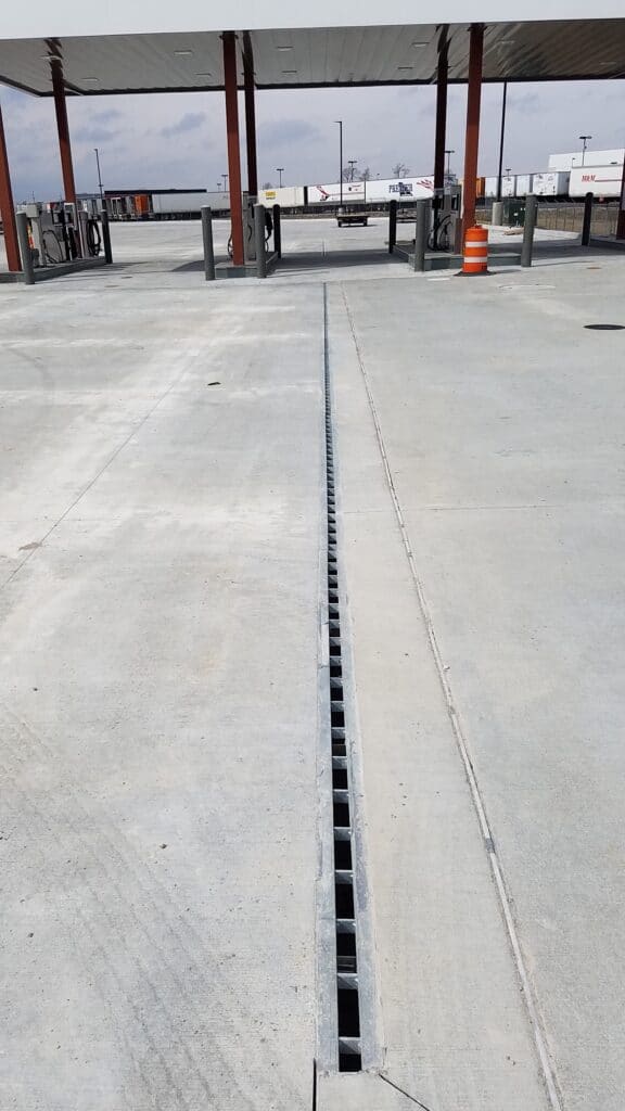 Gas station slot drain