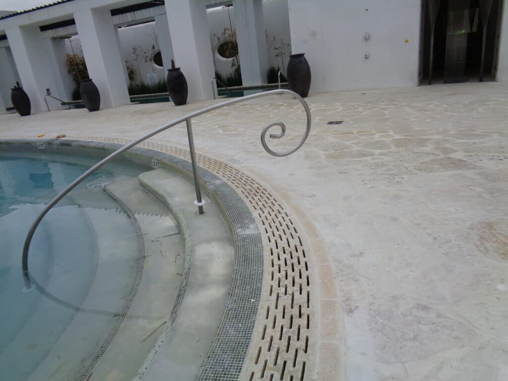 slotted radius trench drain at a pool