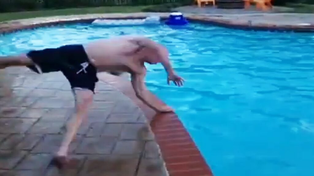 man carwheeling into pool