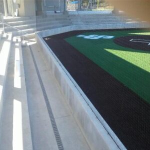 Plastic trench drain grates at sports field