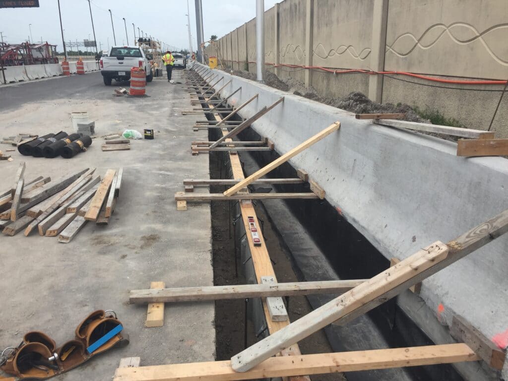 Trench drain system at Jersey Barrier